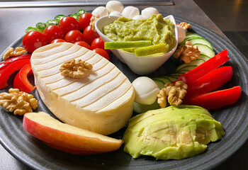 Photography from assorted colorful bread toppings and vegetables, which are arranged decoratively.