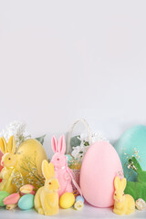 Spring Easter holiday greeting card, sale, invitation background. Easter decorations wide border banner. Colorful Easter Eggs and Bunny Rabbits, with Spring flowers on white background copy space.