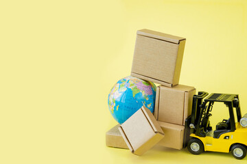 Mini forklift truck load cardboard boxes. Fast delivery of goods and products. Logistics, connection to hard-to-reach places. Banner, copy space