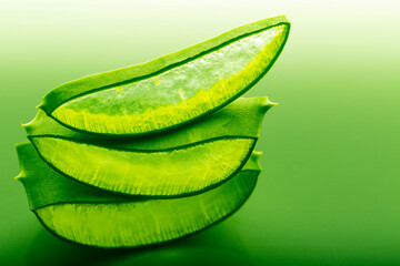 cut aloe leaf in bright light large pieces of aloe close-up