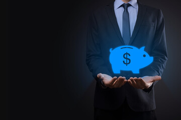 Businessman hold piggy bank icon .Business and Money spending planning, and investment budget, Business saving money concept.save or investment