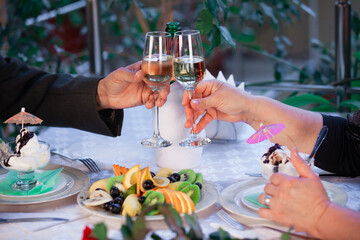 Romantic dinner in a restaurant for an elderly couple