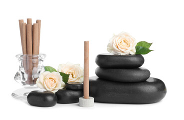 Fototapeta na wymiar Aromatic incense sticks, roses and spa stones on white background