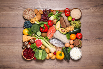 Different products on wooden table, top view. Healthy food and balanced diet