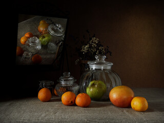 Citrus fruits on the table and mirror.