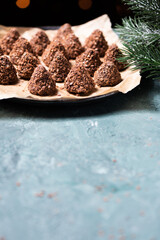 Truffle chocolate candies with assorted wafer crumbs. Sweet homemade dessert on a plate