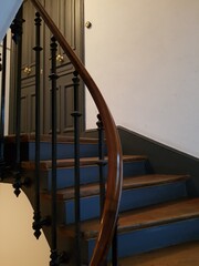 staircase in a Hausmannian building of the 1910s,  with wooden railings