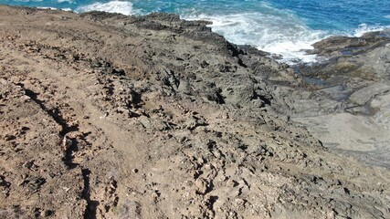 The sea hits the cliffs
