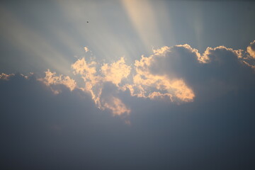 sun beams and clouds