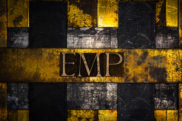 EMP text on vintage textured grunge copper and gold background
