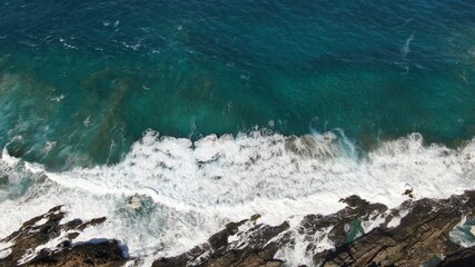 The sea hits the cliffs