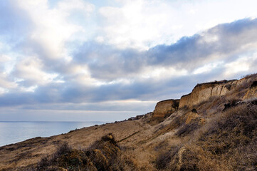 Fototapeta na wymiar coastal slope overlooking the sea and clouds