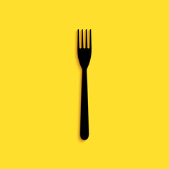 Black Fork icon isolated on yellow background. Long shadow style. Vector.