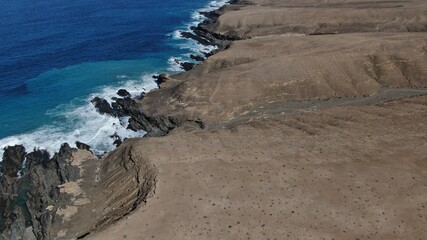 The sea hits the cliffs