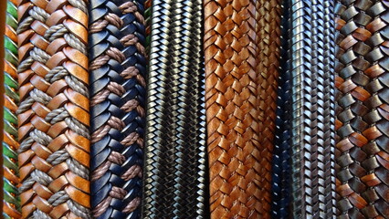 close-up photo of leather belts