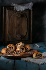 Fresh sweet pastries on wooden table