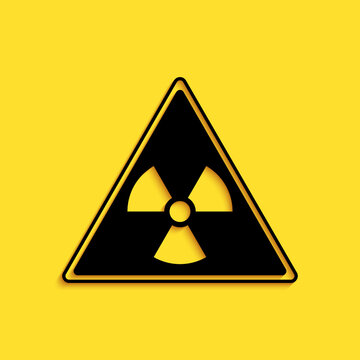 Black Triangle sign with radiation symbol icon isolated on yellow background. Long shadow style. Vector.