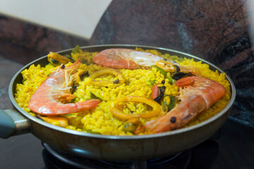 Paella typical spanish food in granite background