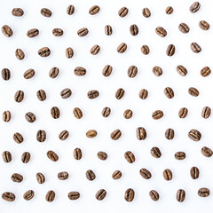 Pattern of roasted coffee beans arrange on white background