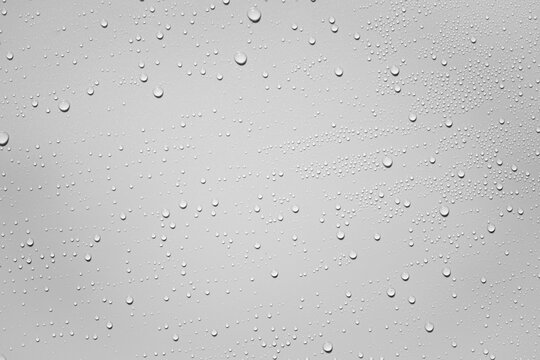 Water Or Rain Drops On White Plastic Sheet Background 