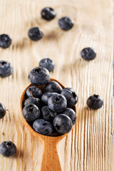 Blueberries. Freshly picked blueberries over wooden table. Juicy and fresh blueberries.