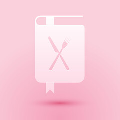 Obraz premium Paper cut Cookbook icon isolated on pink background. Cooking book icon. Recipe book. Fork and knife icons. Cutlery symbol. Restaurant symbol. Paper art style. Vector.