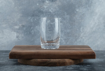 Glass of cold water on wooden board