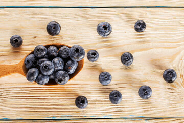 Blueberries. Freshly picked blueberries over wooden table. Juicy and fresh blueberries.