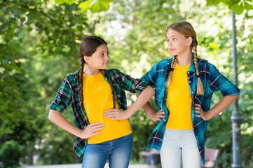 Little children with vogue look pose in casual fashion style summer outdoors, fashionistas