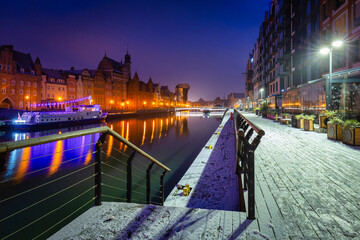 Snowy scenery of Gdansk over Motlawa river at dawn, Poland.