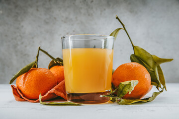 tangerines and a glass of lemonade