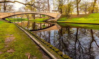 Fototapeta na wymiar Early spring in central park of Riga - the capital and largest city of Latvia, a major commercial, cultural, historical and tourist center of the Baltic region