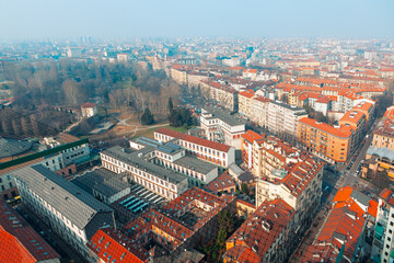 Fototapeta na wymiar Aerial view of Turin city . Panorama of torino in Italy . Aerial shot of streets and rooftops