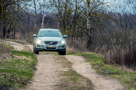 swedish car Volvo XC60 drives on a rural unpaved road, a luxury family car, also designed for difficult off-road trips