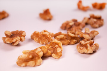 walnuts, peeled on a white surface