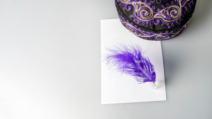 blue pen on white paper next to national cap