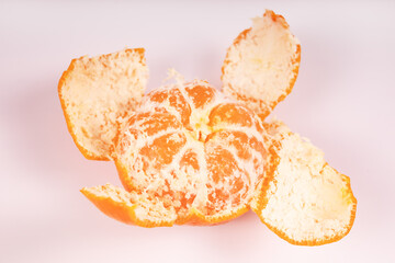 almost completely peeled mandarin close-up