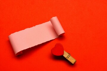 Torn paper with red paper background. Valentine's Day concept