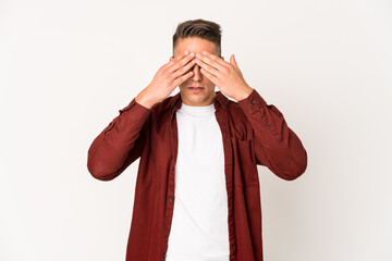 Young caucasian handsome man isolated afraid covering eyes with hands.