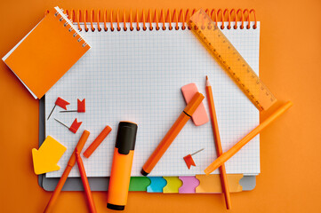 Stationery supplies, opened notepad, top view