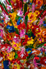 Fototapeta na wymiar paper flowers as a background or decor. Traditional decoration for event or holidays in Vietnam.