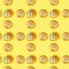 Creative seamless pattern with small round pumpkin. Autumnal holiday concept, fall, harvest, thanksgiving, halloween.