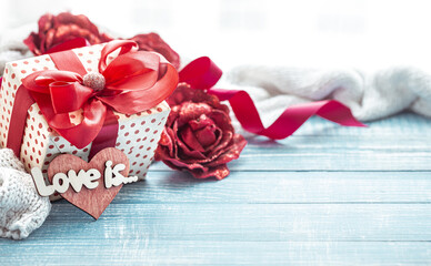 Festive composition for Valentine's Day with gift box and decorative elements copy space.