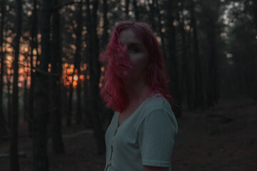 Girl in the forest with pink hair