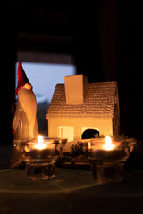 fireplace with burning candle, ceramic candlestick