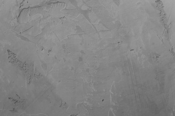 Gray blank surface of a concrete wall with plaster. Abstract design background with fine texture. The backdrop for ads in a loft style