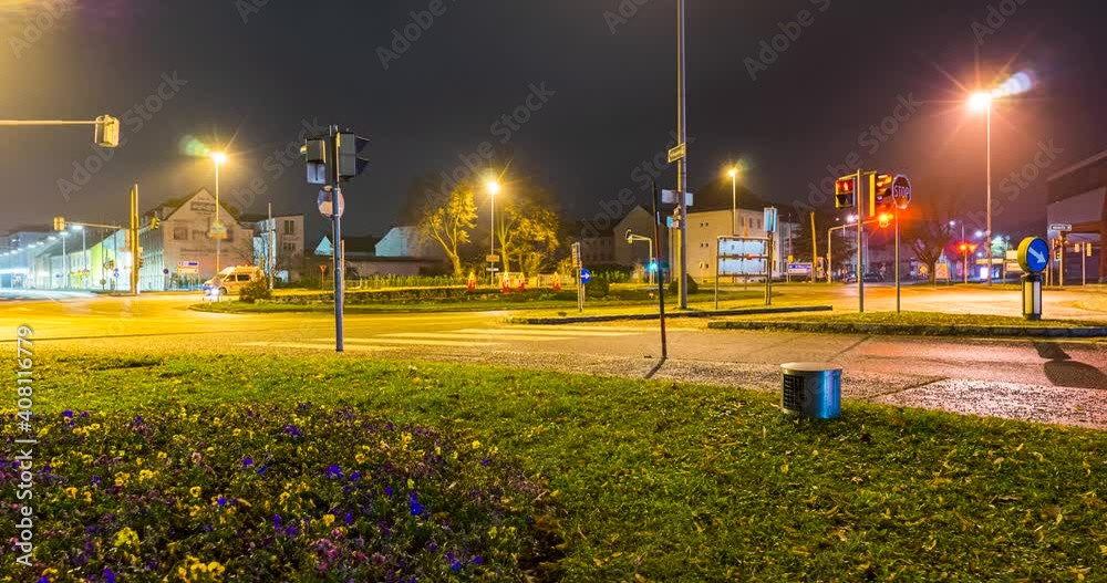 Canvas Prints timelapse of traffic with light trails of cars and city lights at night on a wet road.