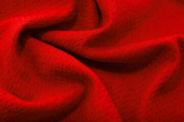 a piece of red cloth. fabric texture for background and design works of art, beautiful wrinkled pattern of silk or linen. A crumpled piece of cloth