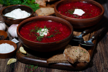 traditional russian dish borsch with sour cream and dill