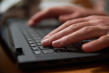 Closeup of a person typing on a laptop. Close up of a person working on a notebook.